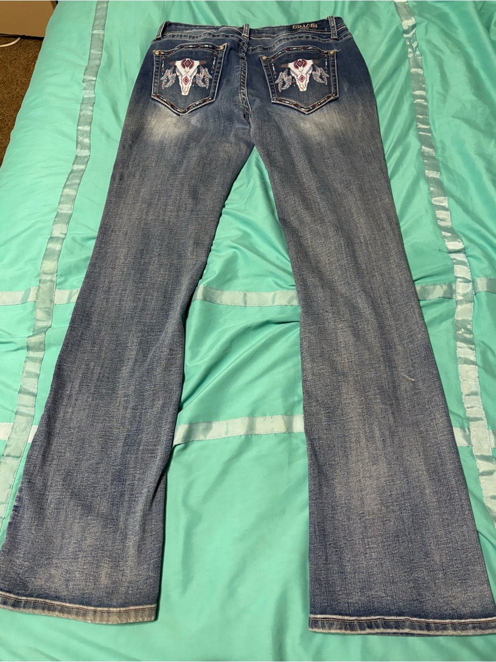 Grace in LA Medium Blue Bootcut Jeans with Embroidered Skull Pockets